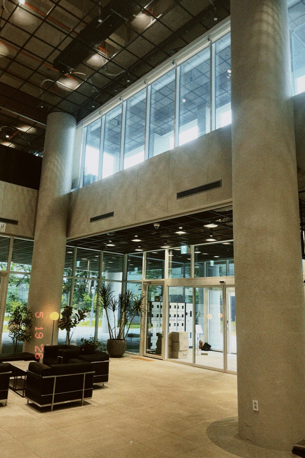 The tall column-lined lobby of the AI Hub