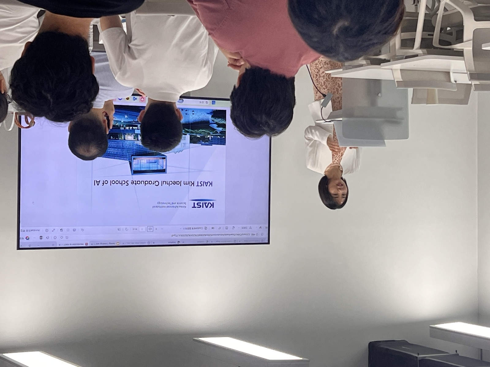 A host introducing the KAIST Kim Jaechul Graduate School of AI