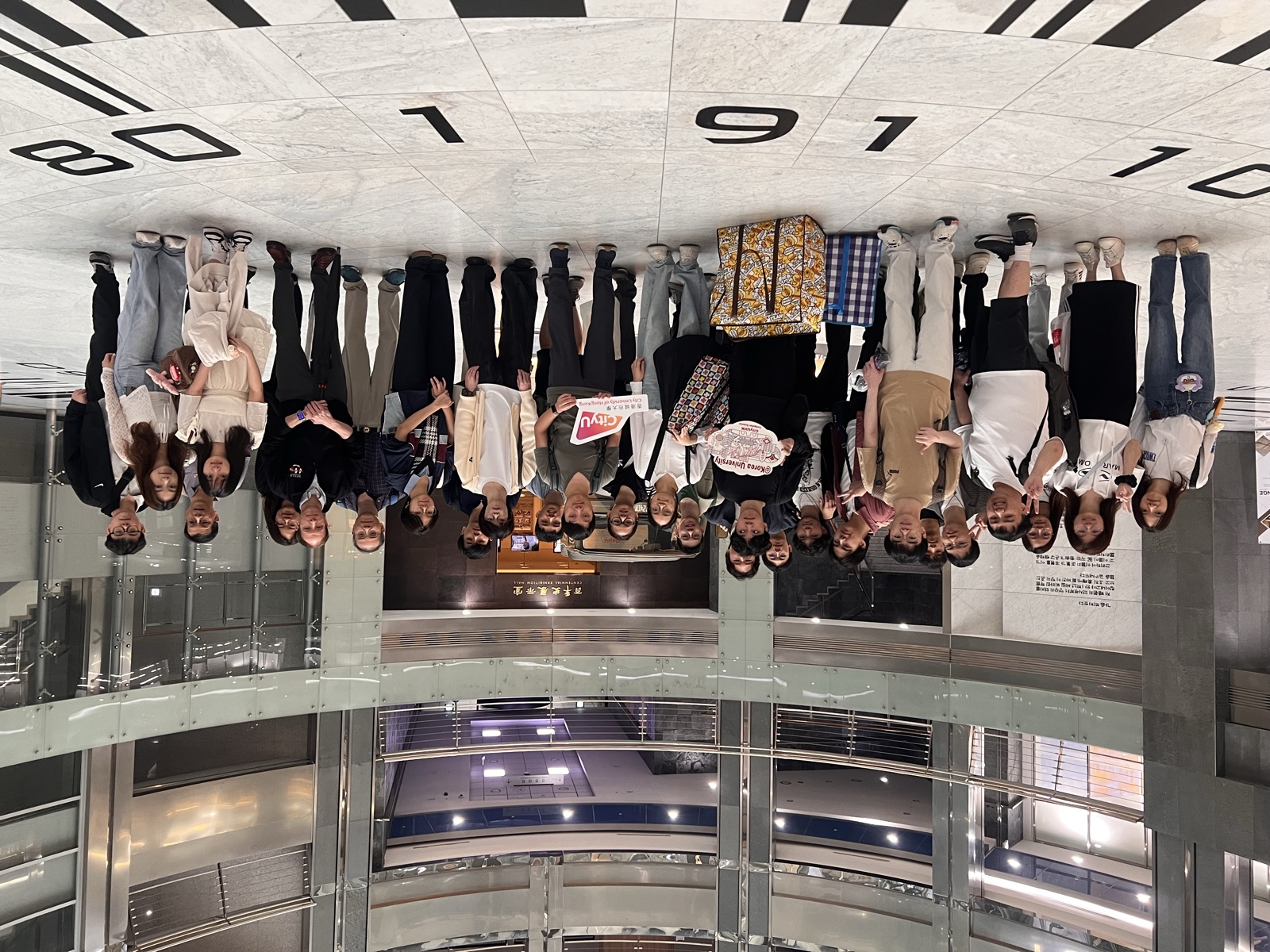A group photo in the glass atrium