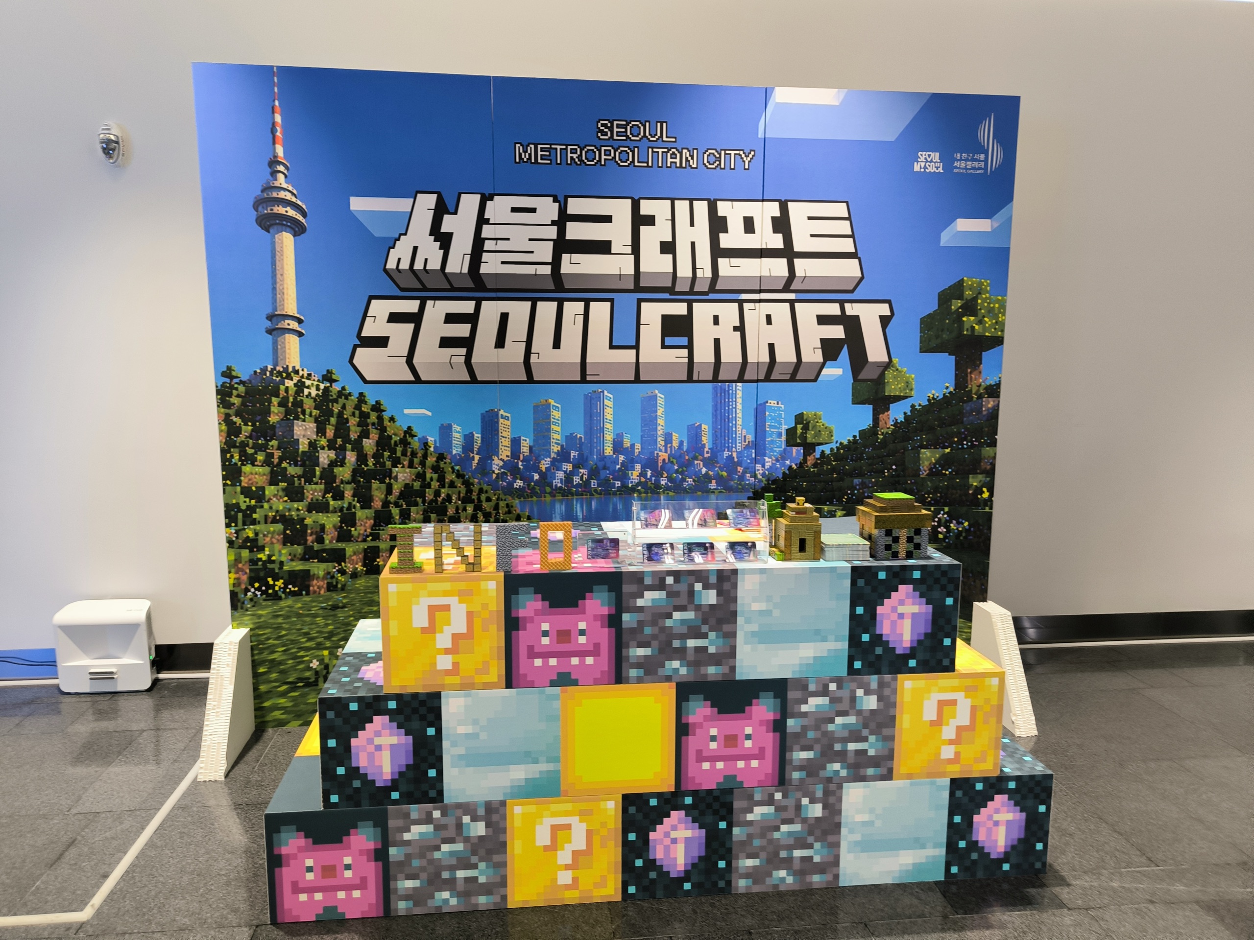 The colourful SEOULCRAFT pixel-art backdrop with N Seoul Tower in Minecraft blocks