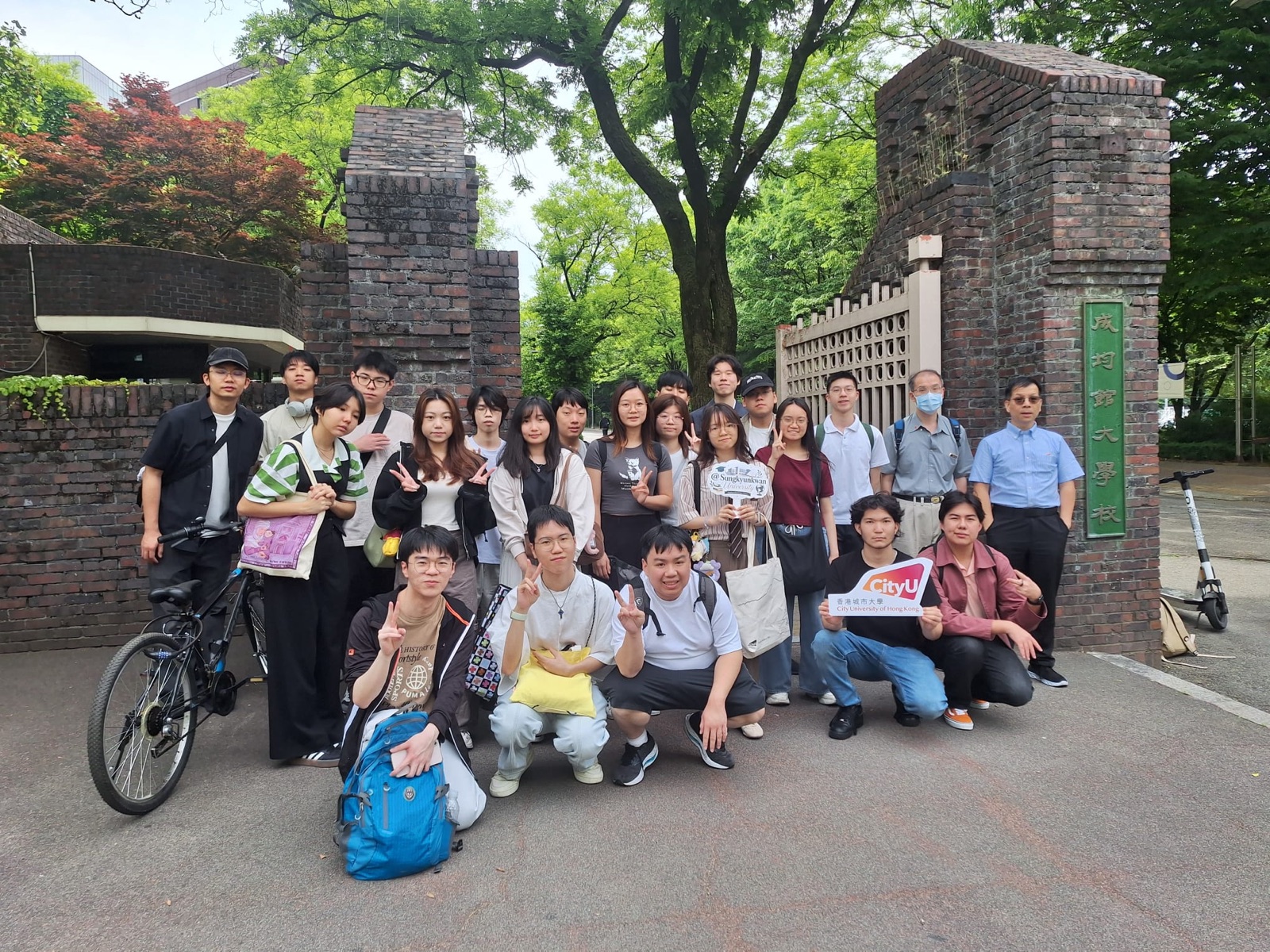 One last group photo at the brick gate before we headed out